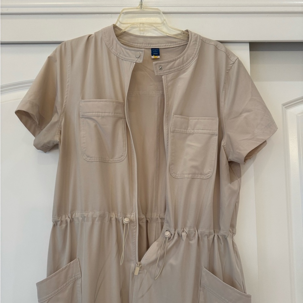 New without tags. Never worn. 
One piece romper. Nylon stretch. Size Large.